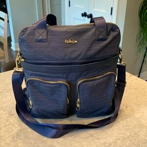 Kipling Travel Bag blue approx 14.5x14.5. Pocket to slide over luggage handle